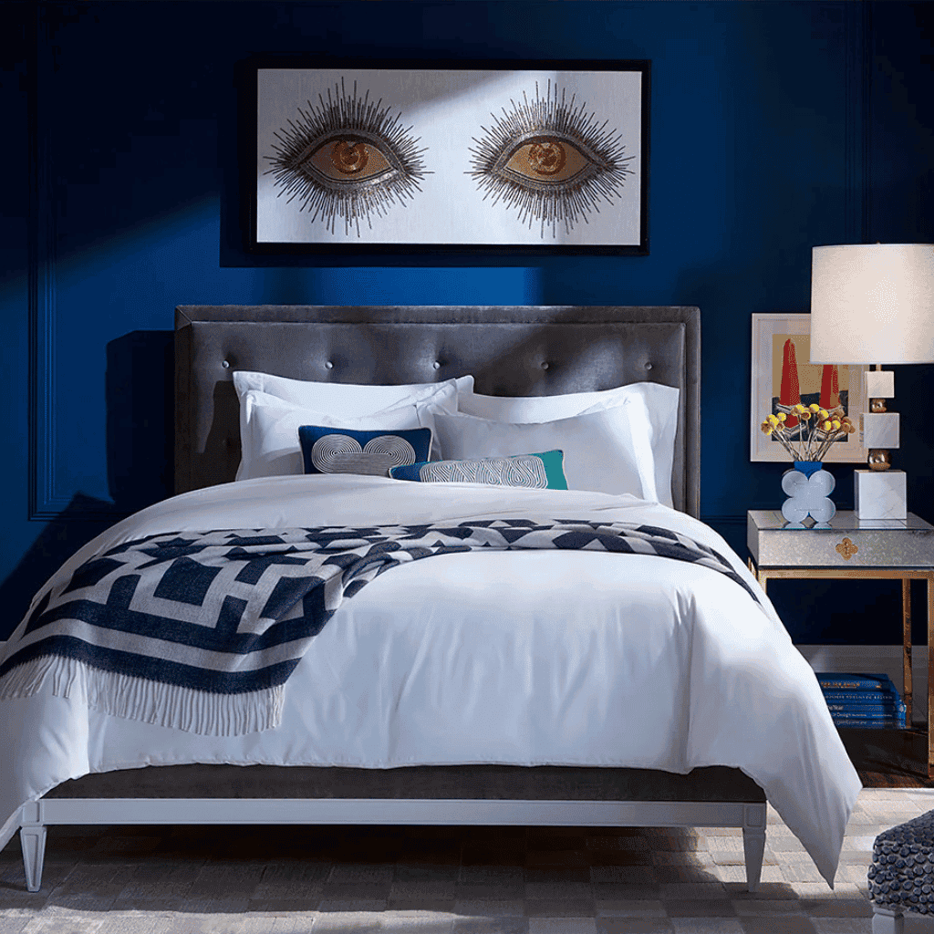 LXURI - luxury bedroom with velvet upholstered Jonathan Adler bed and designer accents