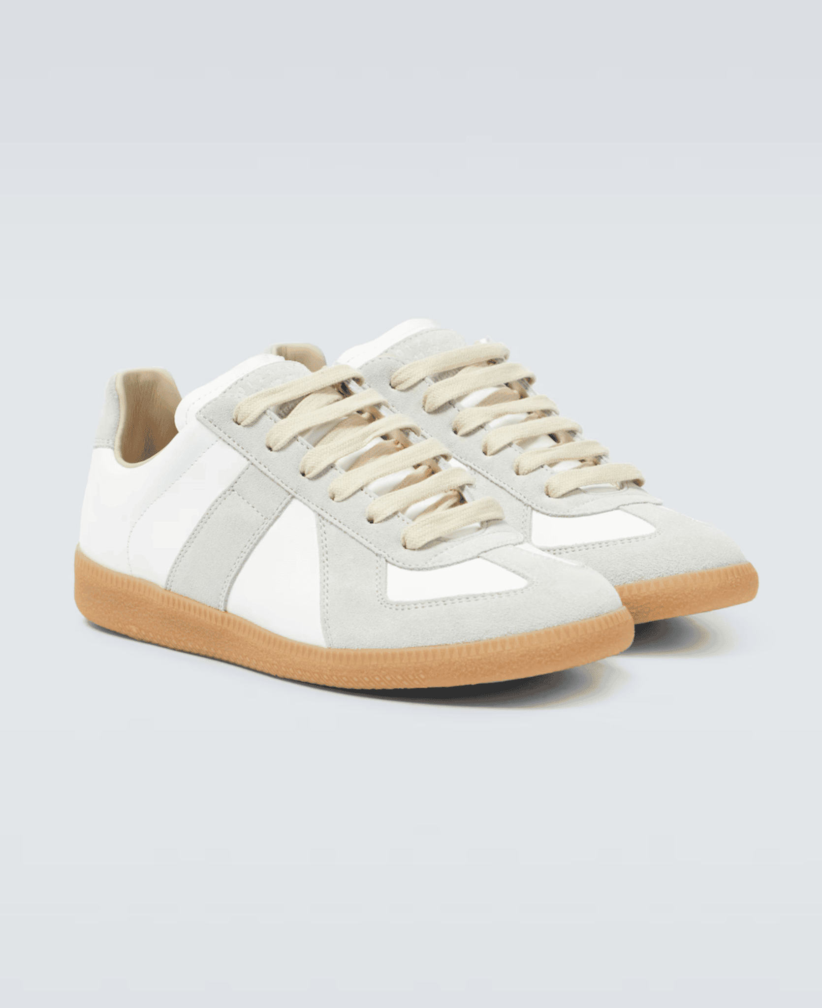 LXURI - Maison Margiela Replica Sneakers: The Icon of Minimalist Luxury